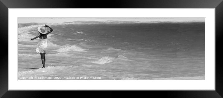 Panoramic happy girl walking through waves on beach Framed Mounted Print by Spotmatik 