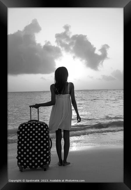 Young woman with suitcase enjoying tropical ocean sunrise Framed Print by Spotmatik 