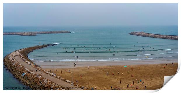 Blue Sea with Red Sand and People Surfing in Rabat Beach, Morocco. Print by Maggie Bajada