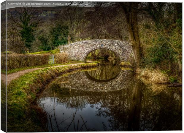 "Tranquil Reflections: Bridge 130 on the Monmouths Canvas Print by Lee Kershaw