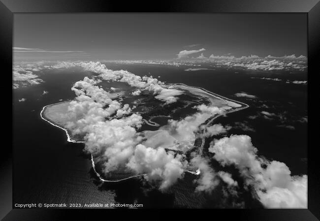 Aerial cloud covered Bora Bora in French Polynesia  Framed Print by Spotmatik 