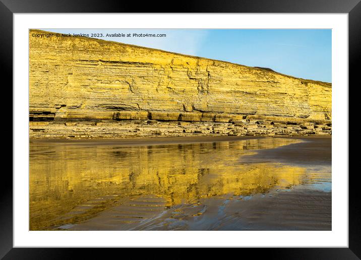 Dunraven Bay Cliffs reflected in the wet sand  Framed Mounted Print by Nick Jenkins