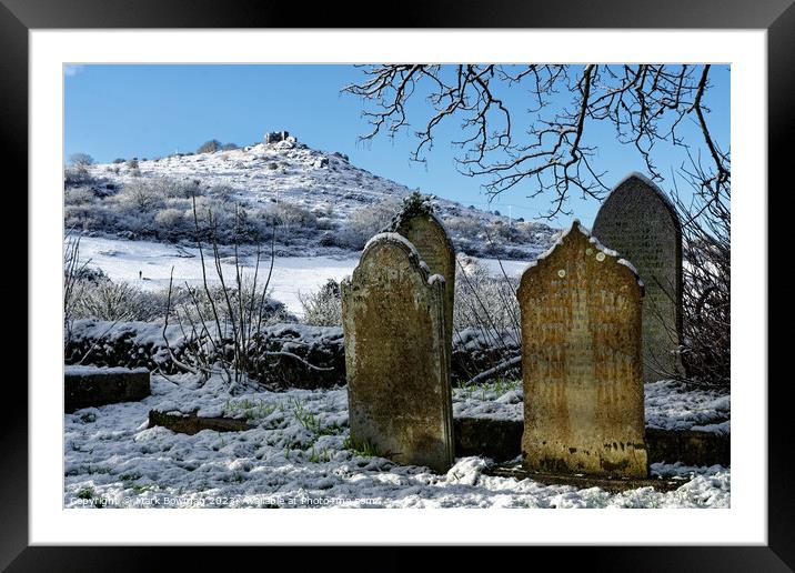 Snow covered gravestones Framed Mounted Print by Mark Bowman