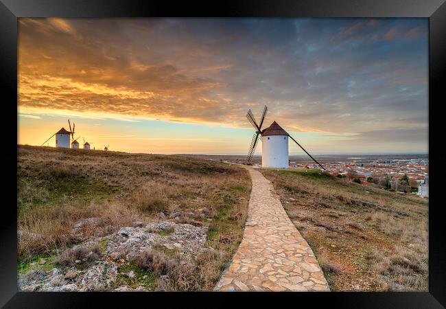 Beautiful sunrise over the Manchegos windmills Framed Print by Helen Hotson