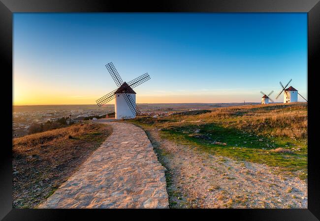 Sunset over Manchegos windmills  Framed Print by Helen Hotson