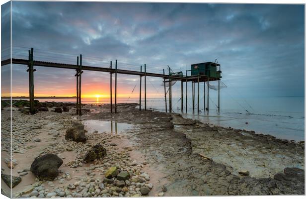 Sunset over fishing carrelets at Marsilly  Canvas Print by Helen Hotson