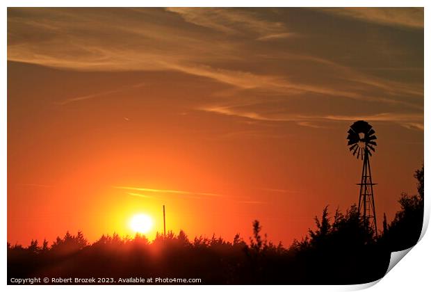 Sunset with an orange sky and Windmill silhouette Print by Robert Brozek