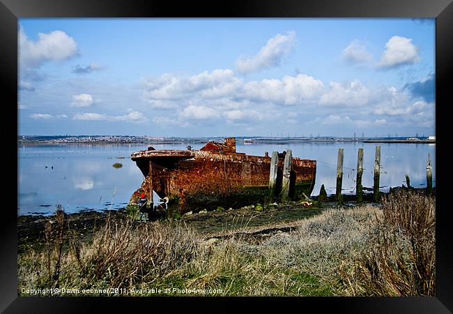 Rusty Wreck on River Medway Framed Print by Dawn O'Connor