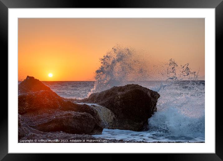 Sea waves crushing and splashing on the rocks in beautiful warm  Framed Mounted Print by Arthur Mustafa