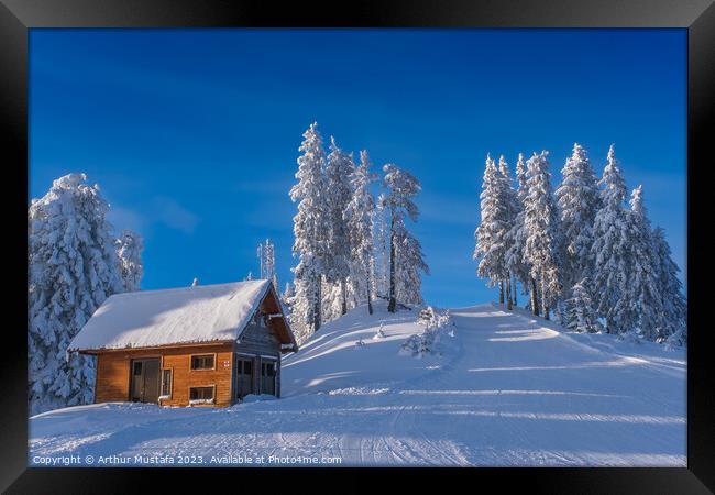 Winter wonderland in the Alps, frozen spruce trees and a cottage Framed Print by Arthur Mustafa