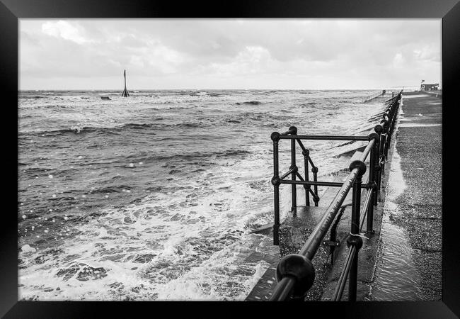 Waves breaking onto the promenade at Crosby Framed Print by Jason Wells