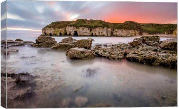 Thornwick Bay Sunrise and Cliff Caves Canvas Print by Tim Hill