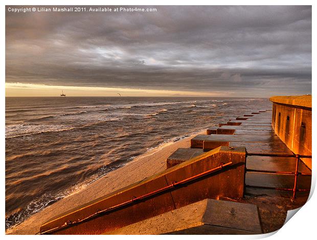 Sunlight on the sea defences Print by Lilian Marshall