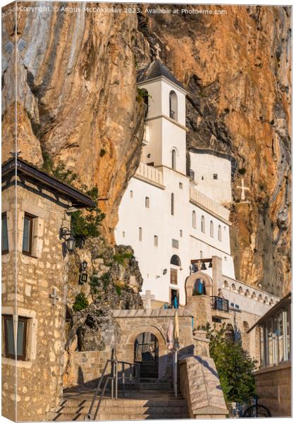 The upper church of Ostrog Monastery in Montenegro Canvas Print by Angus McComiskey