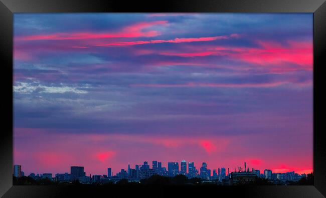 sunset over canary wharf Framed Print by tim miller