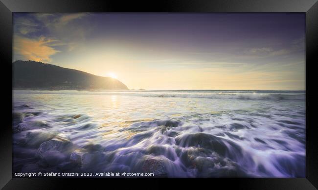 Waves on Baratti beach at sunset. Tuscany, Italy Framed Print by Stefano Orazzini