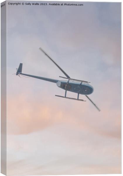 Helicopter flying  Canvas Print by Sally Wallis