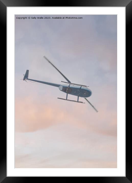 Helicopter flying  Framed Mounted Print by Sally Wallis