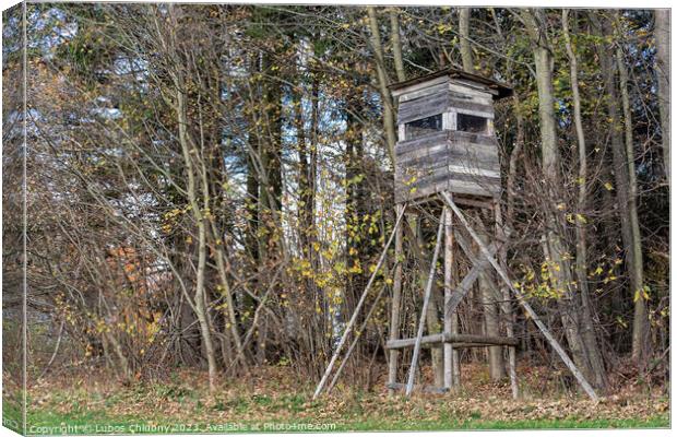Wooden lookout tower for hunting in the woods and on meadow Canvas Print by Lubos Chlubny