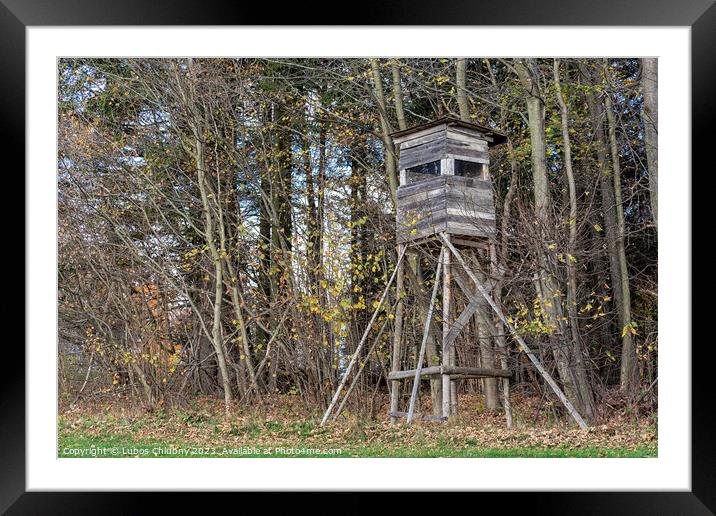 Wooden lookout tower for hunting in the woods and on meadow Framed Mounted Print by Lubos Chlubny
