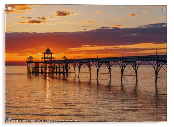 Clevedon Pier at sunset with a streak of sunlight going through the pier head Acrylic by Rory Hailes