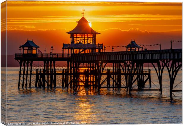 Clevedon at sunset with a streak of sunlight going through the pier head Canvas Print by Rory Hailes