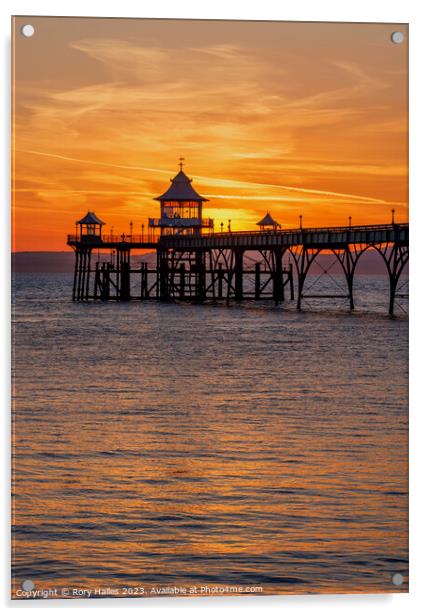 Clevedon pier at sunset with a reddish orangey glow Acrylic by Rory Hailes