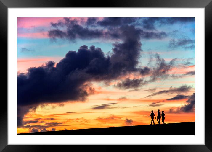 Silhouettes of three girls walking in the sunset Framed Mounted Print by Fabrizio Troiani