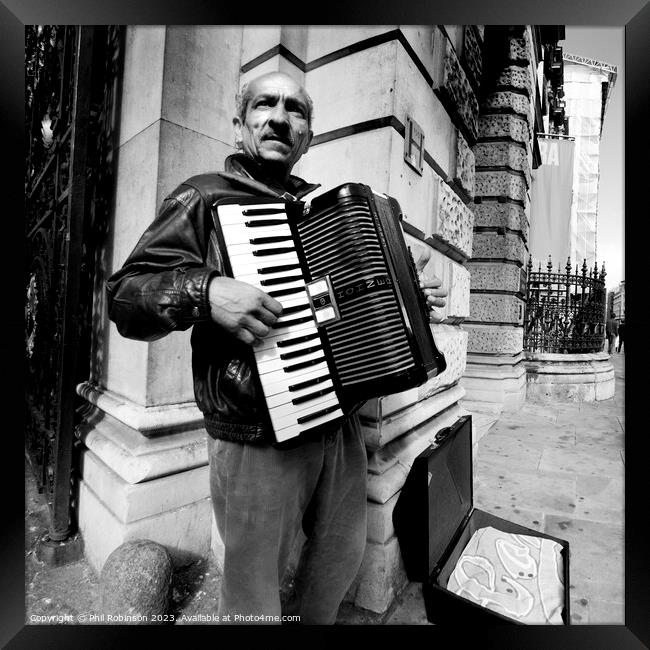 Accordion player, Piccadilly Framed Print by Phil Robinson
