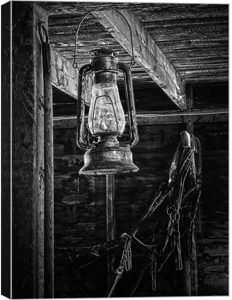 Lantern in the Barn Canvas Print by Dennis Hirning