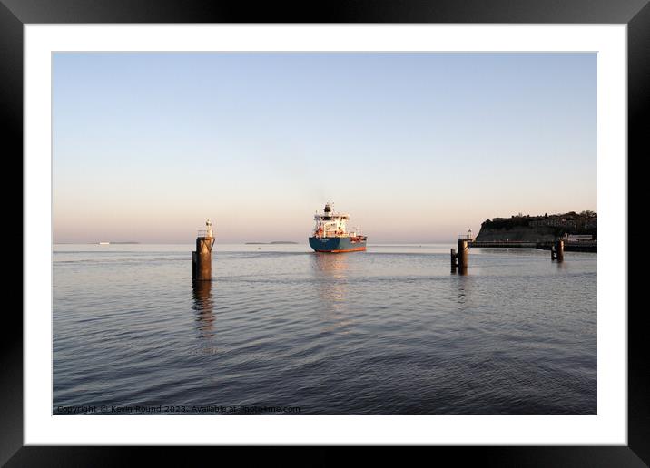 Cargo ship departs Framed Mounted Print by Kevin Round