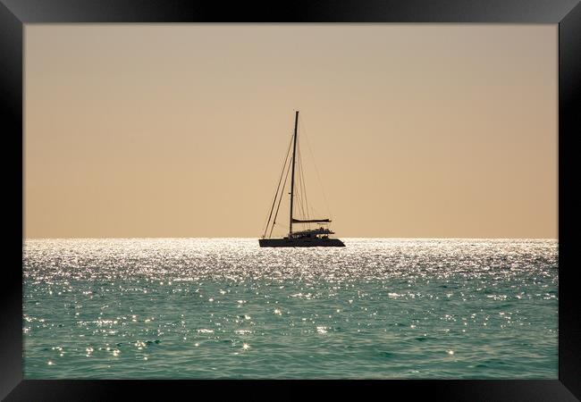 Yacht at Anchor Framed Print by Roger Green