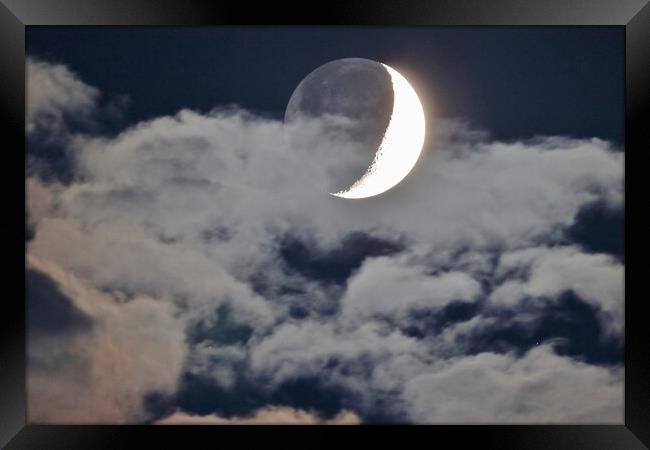 Cloudy Crescent Moon with Earthshine Framed Print by Susan Snow