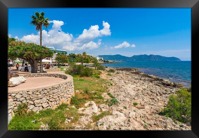 Seaside view of tourist resort in Cala Millor Framed Print by Alex Winter