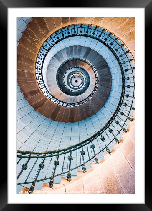 Spiral stairs and blue opaline inside the lighthouse Framed Mounted Print by Laurent Renault