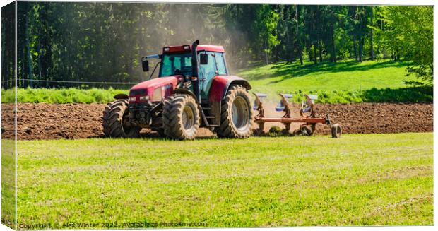 Tractor plowing a field Canvas Print by Alex Winter