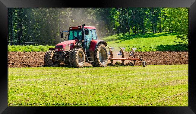 Tractor plowing a field Framed Print by Alex Winter