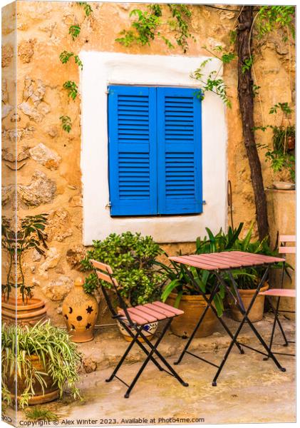 patio house with blue window shutters Canvas Print by Alex Winter