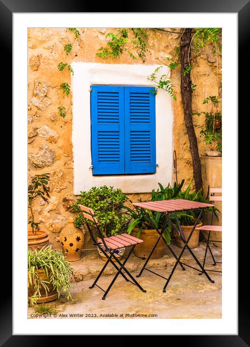 patio house with blue window shutters Framed Mounted Print by Alex Winter