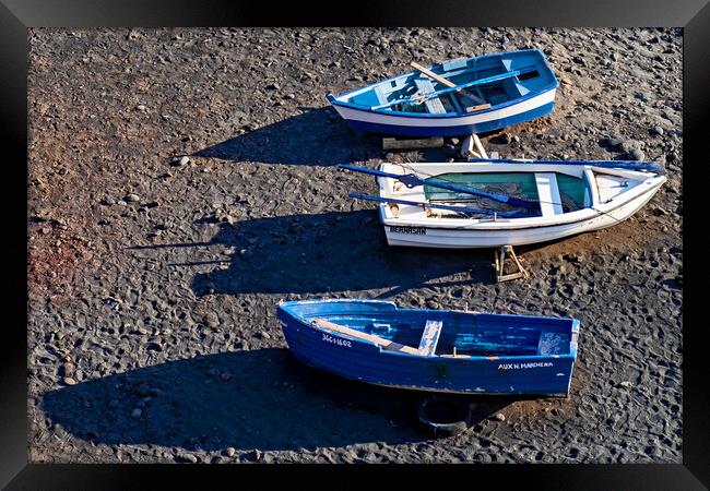 Three boats and their shadows Framed Print by Joyce Storey