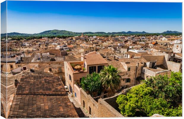 Over the roofs of the old town of Arta Canvas Print by Alex Winter