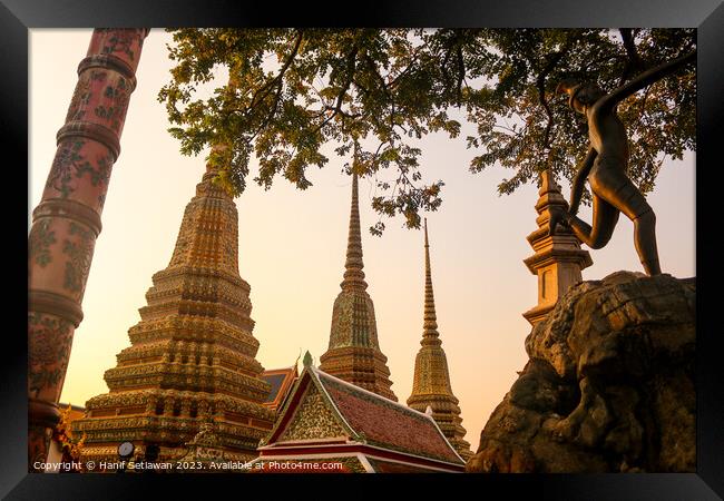 Mosaic tiled Buddha stupas and an iron sculpture a Framed Print by Hanif Setiawan