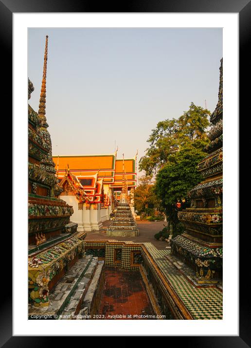 Third sidewalk view of Chedis at Wat Pho. Framed Mounted Print by Hanif Setiawan