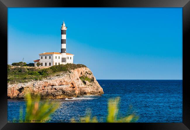 lighthouse at coast cape in Portocolom Framed Print by Alex Winter