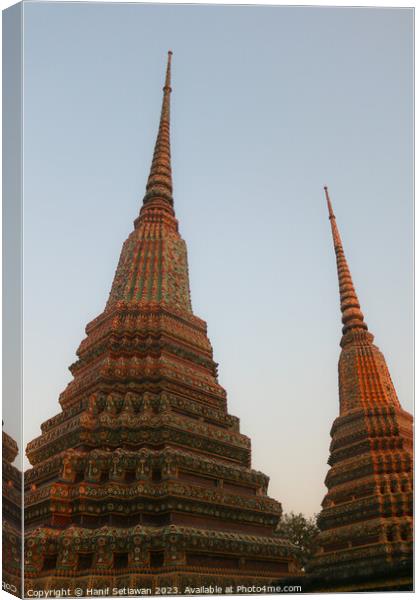 Two stupa against sky at Wat Pho Buddha temple 1 Canvas Print by Hanif Setiawan