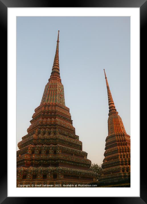 Two stupa against sky at Wat Pho Buddha temple 1 Framed Mounted Print by Hanif Setiawan