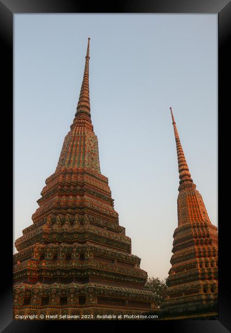 Two stupa against sky at Wat Pho Buddha temple 1 Framed Print by Hanif Setiawan
