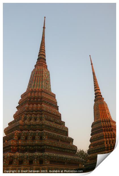 Two stupa against sky at Wat Pho Buddha temple 1 Print by Hanif Setiawan