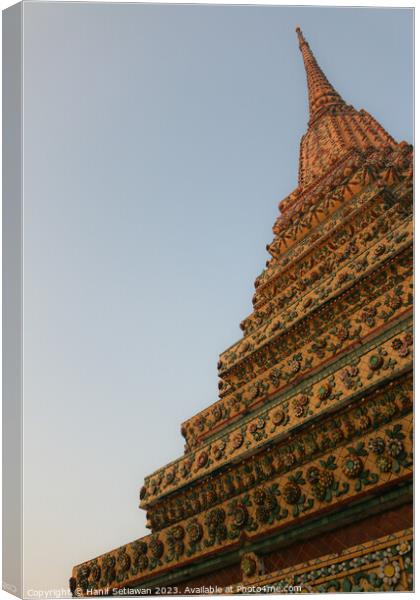 Unique view of a Buddha stupa against clear sky. 1 Canvas Print by Hanif Setiawan