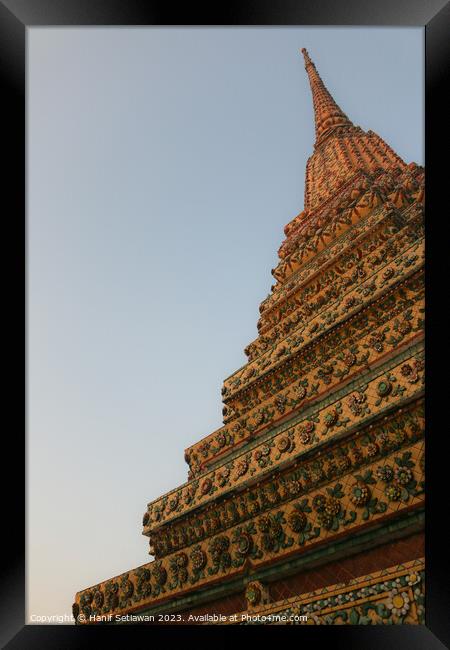 Unique view of a Buddha stupa against clear sky. 1 Framed Print by Hanif Setiawan